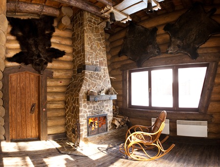 country style interior in hunter chalet with fireplaceの写真素材