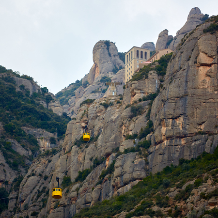 Yellow cable car in the Aeri de Montserrat rise to de Montserrat Abbey near Barcelona, Spain, Catalonia.の写真素材
