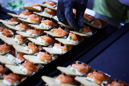 Chef making Norwegian Smoked Salmon Canapes with Cream Cheeseの写真素材