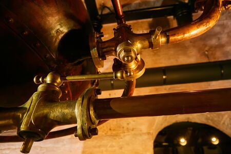 Detalis of medieval traditional distiller cube made from copper production of alcohol, cognac,...