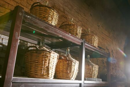 Vintage wine bottles in cellar. Shallow dof.