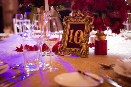 The wedding vintage table with red bouquetの写真素材