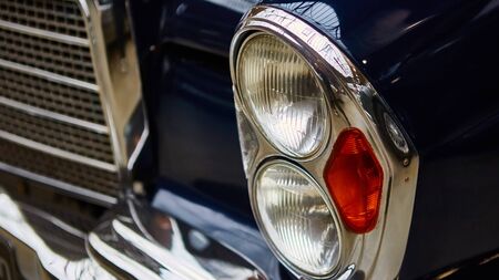 Detail of classic car. Close-up of headlight