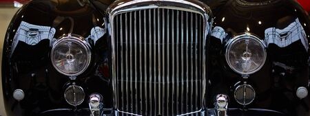 Detail of classic car. Close-up of headlight