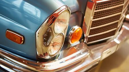 Detail of classic car. Close-up of headlight of the museum of vintage cars