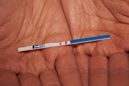 Woman holding pregnancy test, New life and new family concept. Shallow dof.