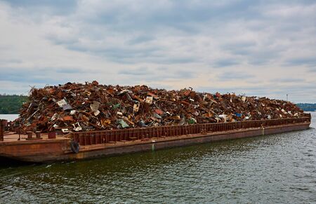 Scrap metal on a barge on a river in Germany