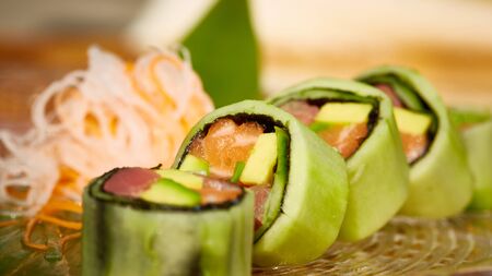 Spring rolls with tuna and salmon. Shallow dof.