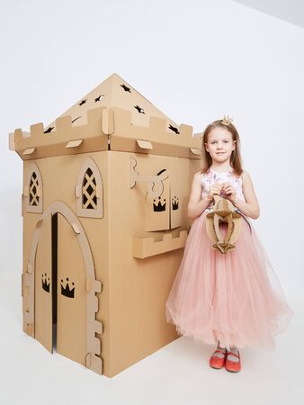 The princess play with cardboard castle tower.の写真素材