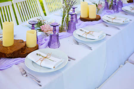 Table set for wedding or another catered event dinner. Shallow dof