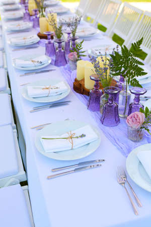 Table set for wedding or another catered event dinner. Shallow dofの写真素材