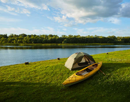 Rafting on kayak. A tent stands on the river bank.の写真素材