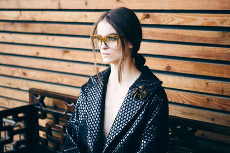 fashion hipster portrait of young beautiful woman posing outdoor in summerの写真素材