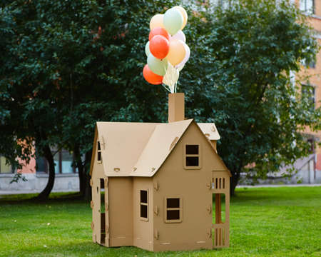 Cardboard playhouse in the backyard for kids. Eco conceptの写真素材