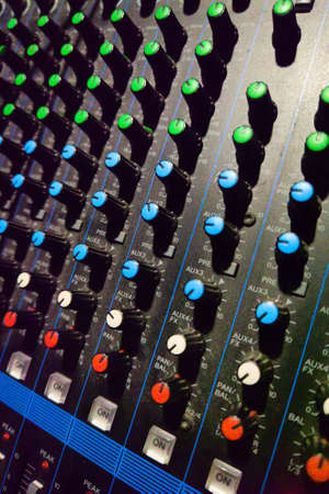 Professional sound and audio mixer control panel with buttons. Shallow dof