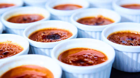 Rows of Creme brulee. Traditional French vanilla cream dessert with caramelised sugar on top. Shallow dofの写真素材