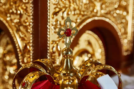 Traditional wedding crowns in a church. Wedding crown in church ready for marriage ceremonyの写真素材