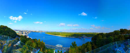 Aerial top view of Kyiv cityscape, Dnieper river and Podol historical district skyline from above, Kontraktova square with ferris wheel, city of Kiev, Ukraine.の写真素材