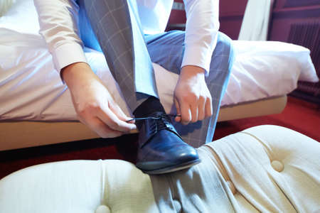 Business man or groom dressing up with classic elegant shoes.の写真素材