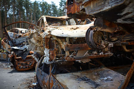 A lot of rusty burnt cars in Irpen, after being shot by the Russian military. Russias war against...