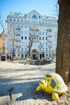 Kyiv, Ukraine - October 16, 2022: People near the funnel from the explosion of a Russian rocket on a childrens playground in the center of the capital.のeditorial素材