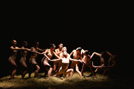 Group of modern ballet dancers. Contemporary art. Young flexible athletic men and women. Concept of dance grace, inspiration, creativity. Group of 11 models.の写真素材
