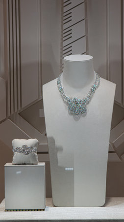 An exquisite diamond necklace and bracelet on display. A concept for luxury, wealth, high fashion, and exclusive giftsの写真素材