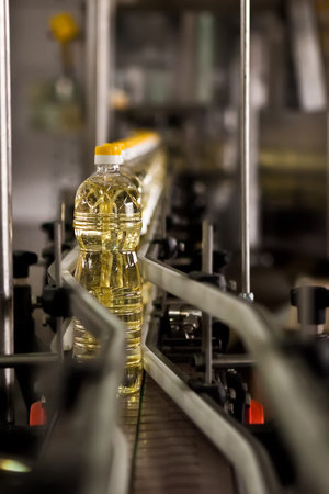Automated production line bottling golden sunflower oil in a modern food manufacturing plantの写真素材