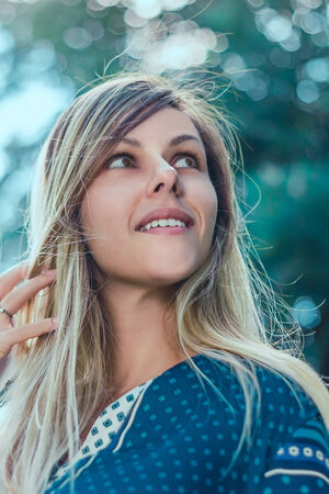 Girl smiling in the windの写真素材