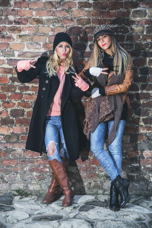 Girlfriends showing peace signsの写真素材