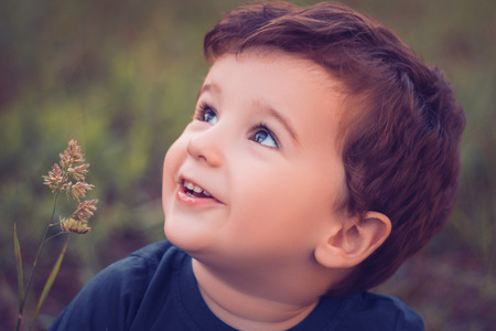 Boy looking up and smiling