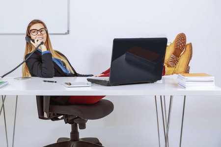 Business woman talking over the phoneの写真素材