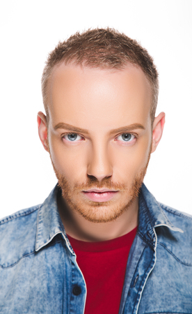 Portrait of a young man with blond hair and blue eyesの写真素材