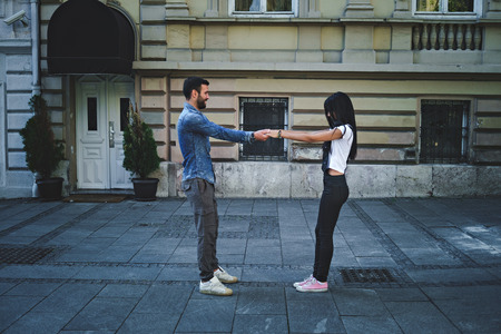 Couple playing in the streetの写真素材