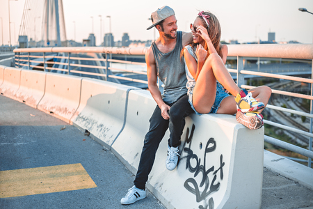 Fashionable couple looking at each otherの写真素材