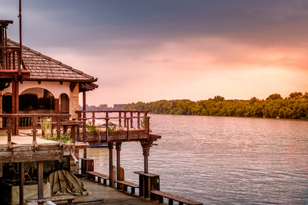 House on the river with sunset view. Eveningの写真素材