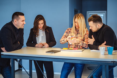 Colleagues working casually at the meeting table