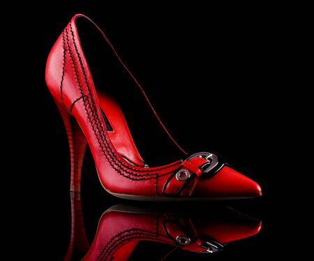 Red high heel shoe on black backgroundの写真素材