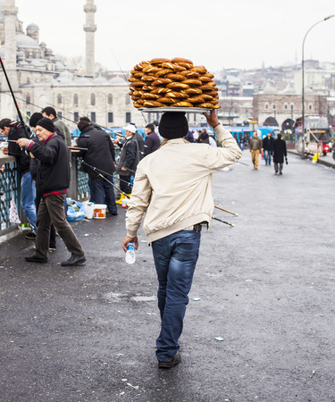 ISTANBUL TURKEY  DECEMBER 29. 2009: Unidentified street vendor selling simits on a street nearby Eminonu district Istanbul Turkey.のeditorial素材