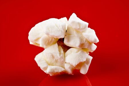Popcorn closeup on red backgroundの写真素材