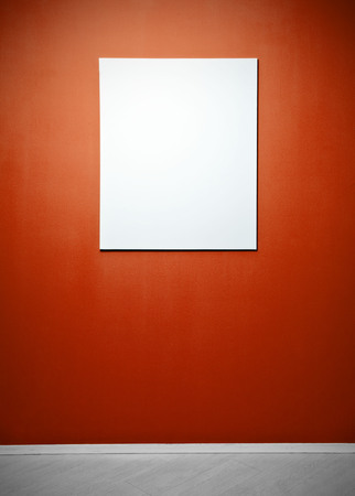 Blank picture poster in a red gallery wallの写真素材