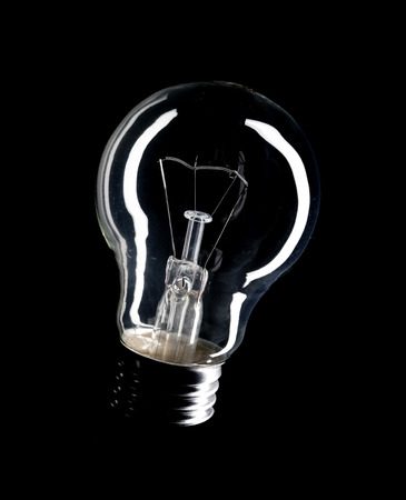 Lightbulb vintage isolated on black backgroundの写真素材