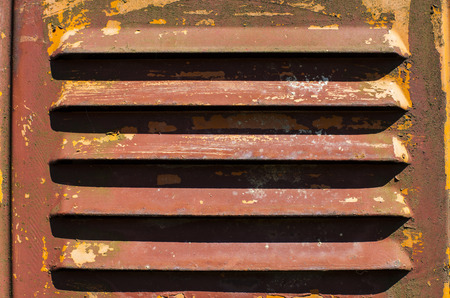 Old scratched paint and rust metal surface air ventの写真素材