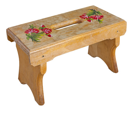 wooden traditional small seating stool isolated over white