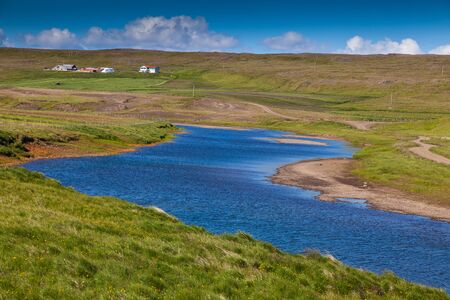 Icelandic landscape with blue waater streamの写真素材