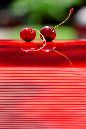 Close up of fresh cherry berries photographed in daylight conditionsの写真素材