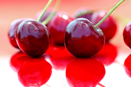 Close up of fresh cherry berries photographed in daylight conditionsの写真素材
