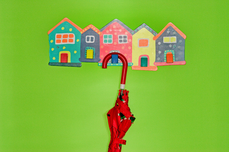 Umbrella for children on hanger in a green roomの写真素材