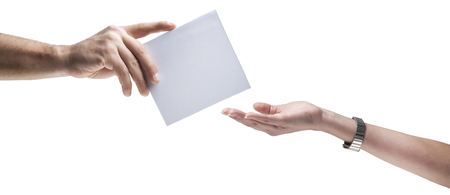 Hands holding, delivering blank piece of paper