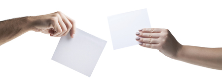 Hands holding, delivering blank piece of paperの写真素材